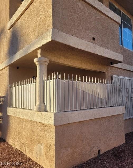 1830 N Pecos Rd Unit 155, Las Vegas, NV 89115 - view of side of home with stucco siding and fence