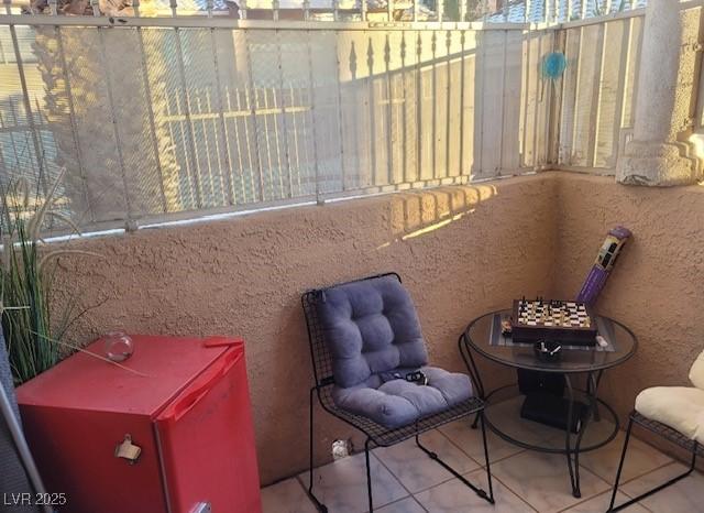 1830 N Pecos Rd Unit 155, Las Vegas, NV 89115 - living area featuring tile patterned flooring and a textured wall