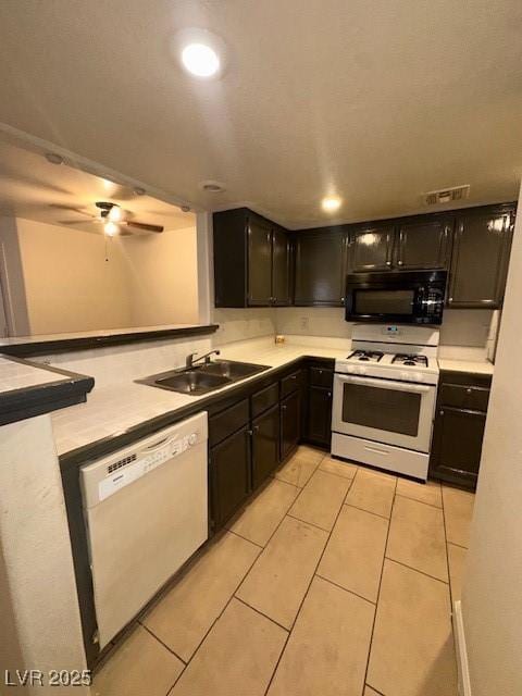 1830 N Pecos Rd Unit 155, Las Vegas, NV 89115 - kitchen with white appliances, a sink, light tile patterned floors, ceiling fan, and light countertops