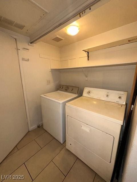 1830 N Pecos Rd Unit 155, Las Vegas, NV 89115 - washroom with independent washer and dryer and light tile patterned flooring