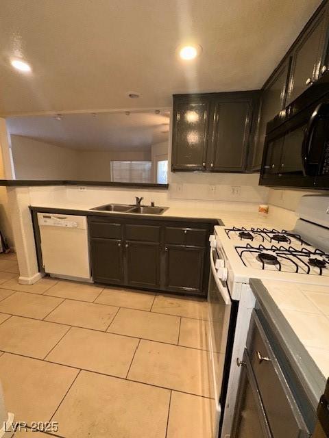 1830 N Pecos Rd Unit 155, Las Vegas, NV 89115 - kitchen with white appliances, a sink, light countertops, light tile patterned floors, and recessed lighting