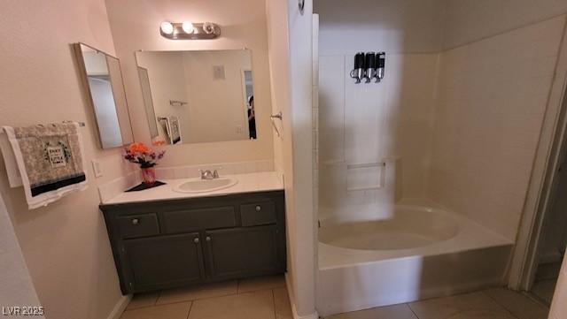 1830 N Pecos Rd Unit 155, Las Vegas, NV 89115 - bathroom featuring tile patterned floors, vanity, and tub / shower combination