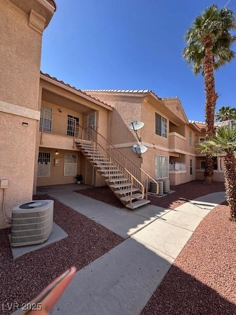 1830 N Pecos Rd Unit 155, Las Vegas, NV 89115 - view of property with stairway and central air condition unit