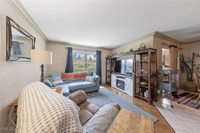 living room featuring wood finished floors and crown molding