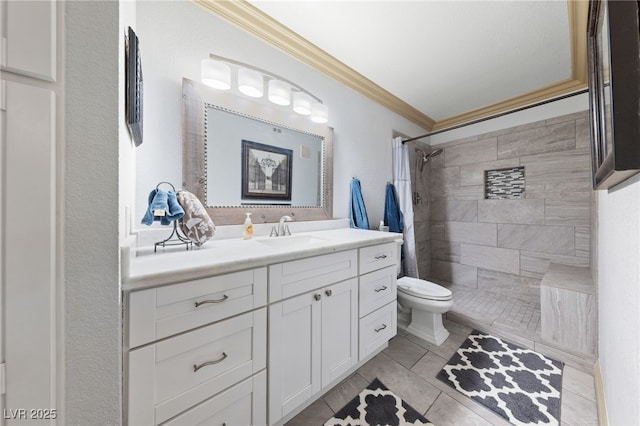 full bathroom featuring crown molding, toilet, a tile shower, vanity, and tile patterned flooring