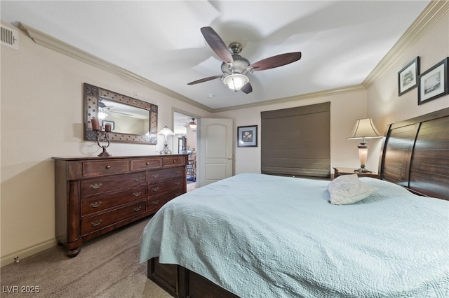 bedroom featuring light colored carpet, baseboards, ornamental molding, and ceiling fan