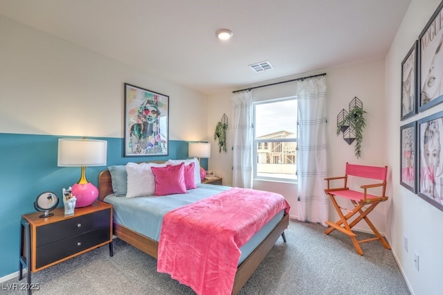 carpeted bedroom featuring baseboards
