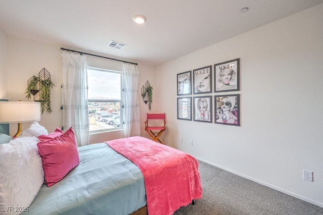 bedroom with carpet and baseboards