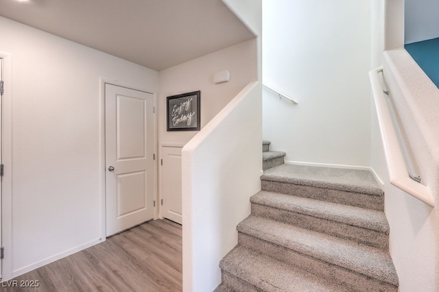 stairs with wood finished floors