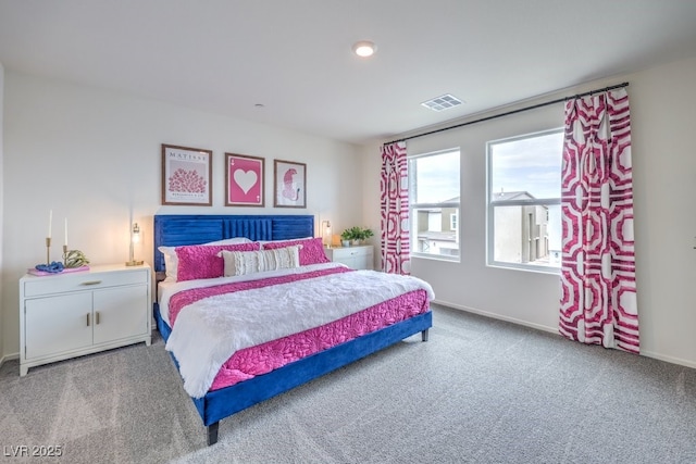 carpeted bedroom with baseboards