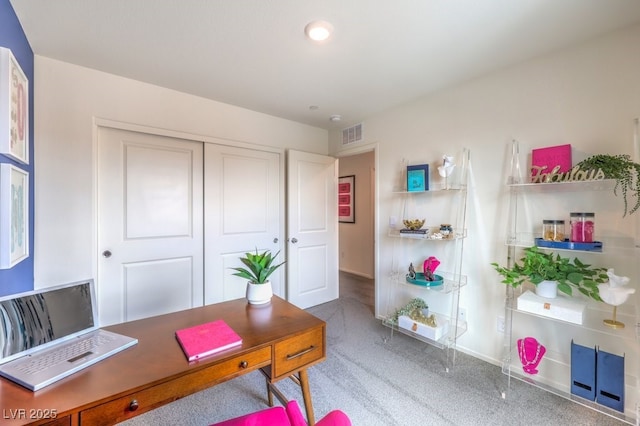 office space featuring carpet floors and baseboards