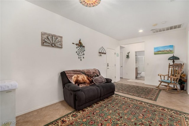 sitting room featuring baseboards, recessed lighting, and tile patterned flooring