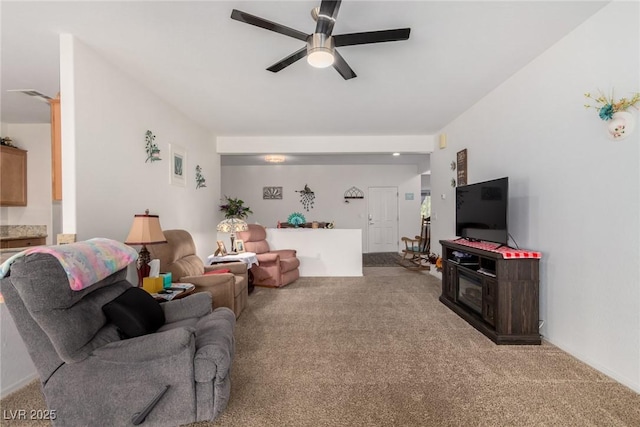 living room featuring carpet floors and a ceiling fan