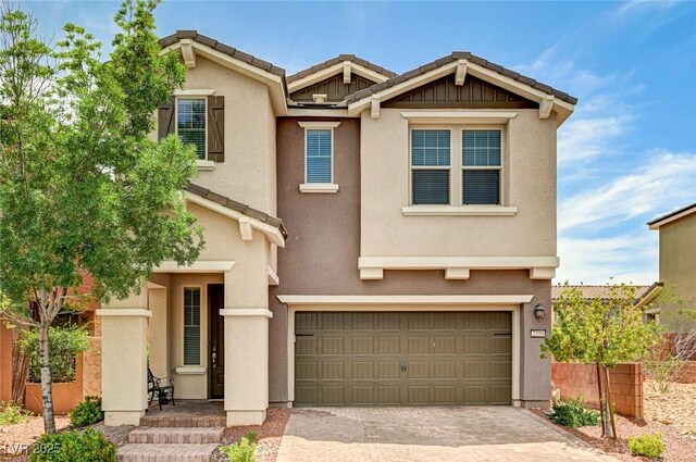 2159 Morro Vista Dr, Las Vegas, NV 89135 - view of front facade featuring a garage, stucco siding, and driveway