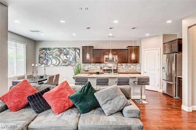 2159 Morro Vista Dr, Las Vegas, NV 89135 - living room with dark wood-type flooring and recessed lighting