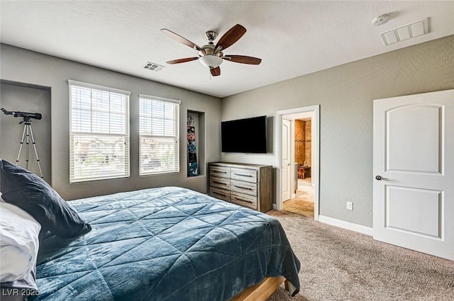 2159 Morro Vista Dr, Las Vegas, NV 89135 - carpeted bedroom featuring a ceiling fan, baseboards, and ensuite bathroom