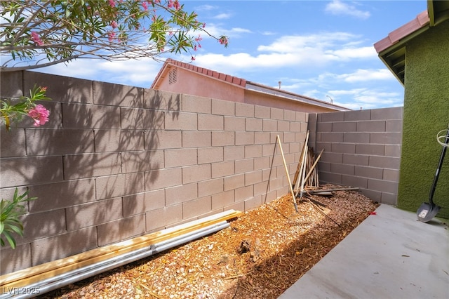 exterior view of fence and stucco siding