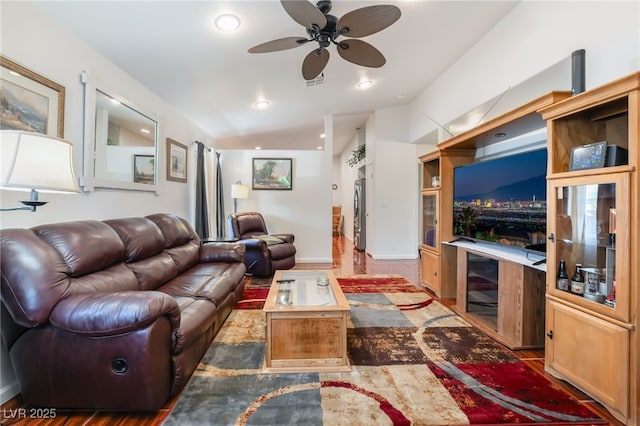 living area with a ceiling fan, wood finished floors, and recessed lighting