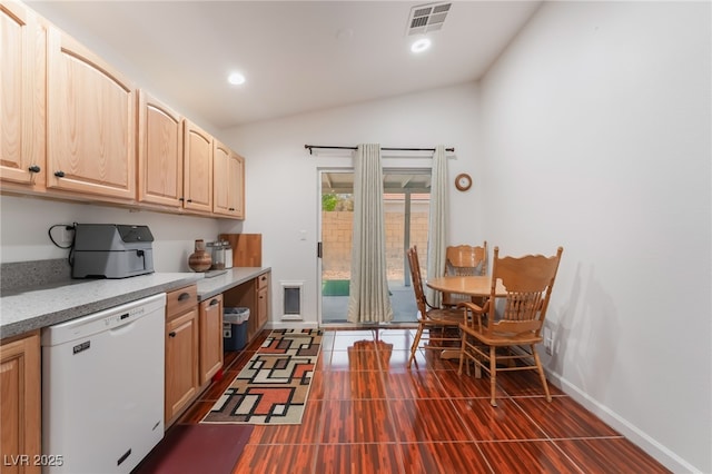 kitchen featuring dishwasher, light brown cabinets, lofted ceiling, baseboards, and recessed lighting