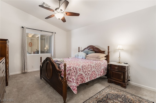 bedroom with vaulted ceiling, light colored carpet, baseboards, and ceiling fan