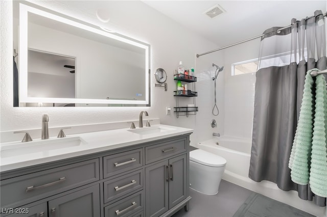 bathroom featuring shower / tub combo with curtain, toilet, and double vanity