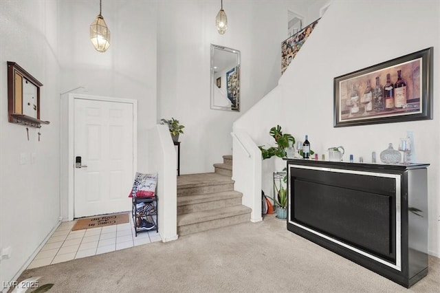 3389 Commendation Dr, Las Vegas, NV 89117 - carpeted entrance foyer featuring stairs and baseboards
