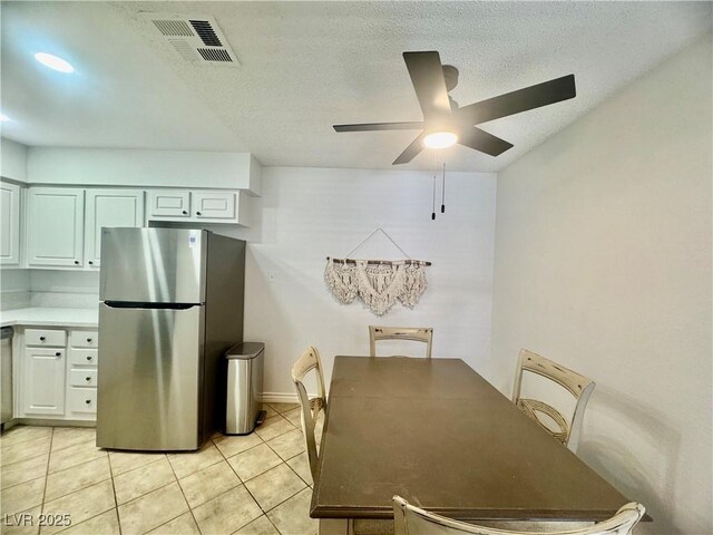 3151 Soaring Gulls Dr Unit 1023, Las Vegas, NV 89128 - dining area with ceiling fan, light tile patterned floors, and a textured ceiling