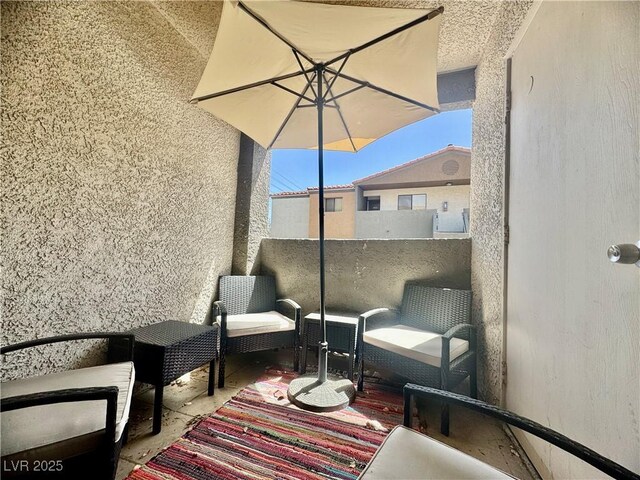 3151 Soaring Gulls Dr Unit 1023, Las Vegas, NV 89128 - view of patio featuring a balcony