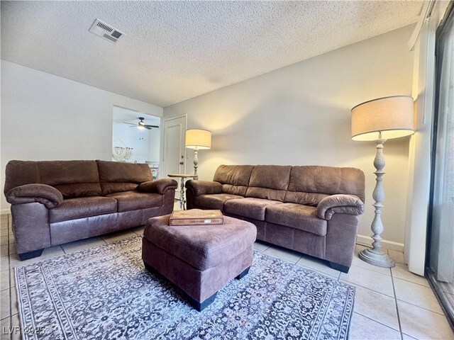 3151 Soaring Gulls Dr Unit 1023, Las Vegas, NV 89128 - living area with light tile patterned floors and a textured ceiling