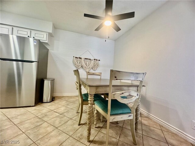 3151 Soaring Gulls Dr Unit 1023, Las Vegas, NV 89128 - dining space featuring light tile patterned floors, ceiling fan, and baseboards