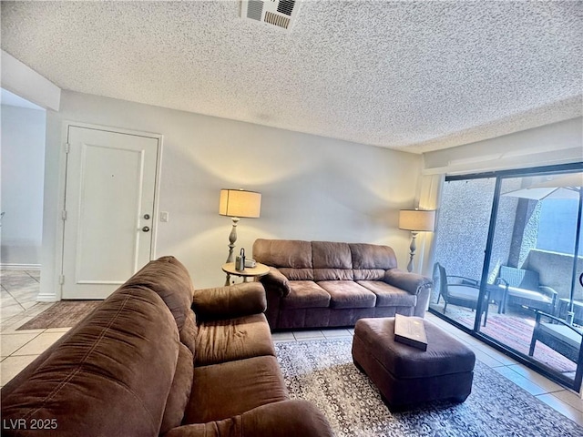 3151 Soaring Gulls Dr Unit 1023, Las Vegas, NV 89128 - living room with tile patterned floors and a textured ceiling