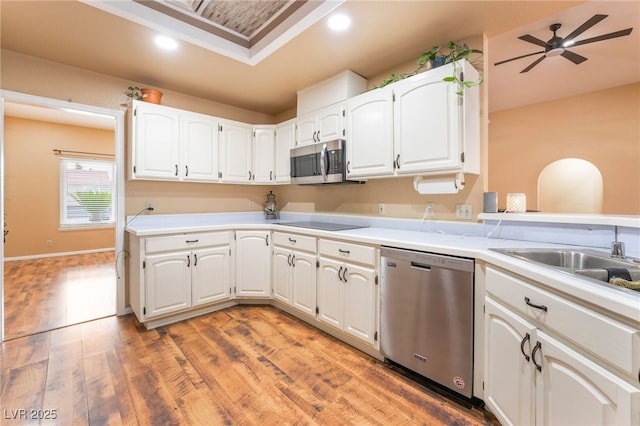 120 N Phyllis St, Las Vegas, NV 89110 - kitchen featuring appliances with stainless steel finishes, light wood-type flooring, white cabinetry, light countertops, and recessed lighting