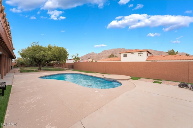 120 N Phyllis St, Las Vegas, NV 89110 - view of swimming pool with a mountain view, a patio area, and a fenced backyard