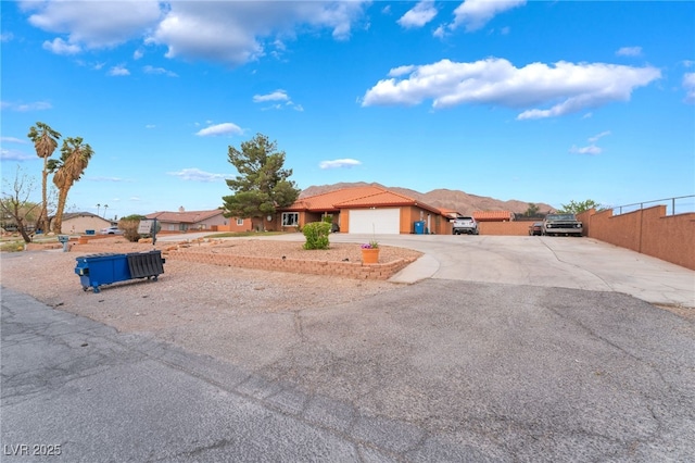 120 N Phyllis St, Las Vegas, NV 89110 - ranch-style house with an attached garage, driveway, and fence