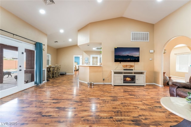 120 N Phyllis St, Las Vegas, NV 89110 - living area with arched walkways, french doors, wood finished floors, recessed lighting, and baseboards
