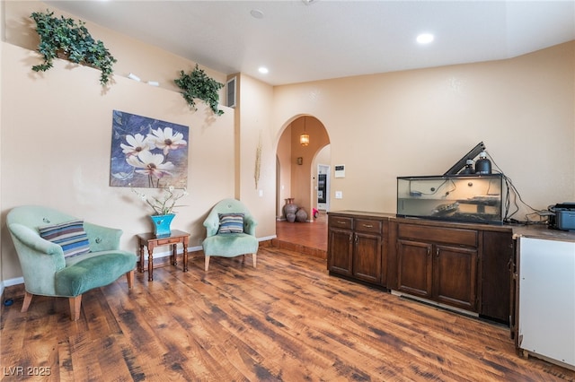 120 N Phyllis St, Las Vegas, NV 89110 - sitting room featuring arched walkways, wood finished floors, and recessed lighting