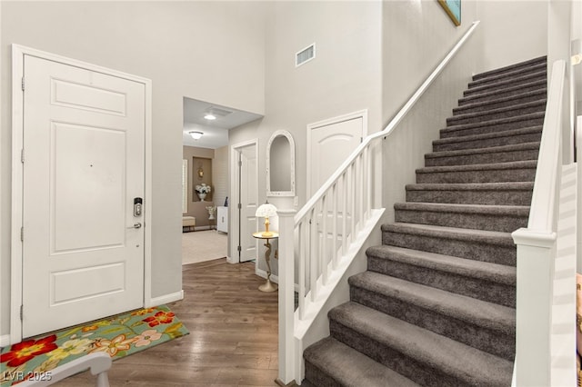 419 Vigo Port St, Las Vegas, NV 89138 - entryway featuring stairway, wood finished floors, baseboards, and a towering ceiling