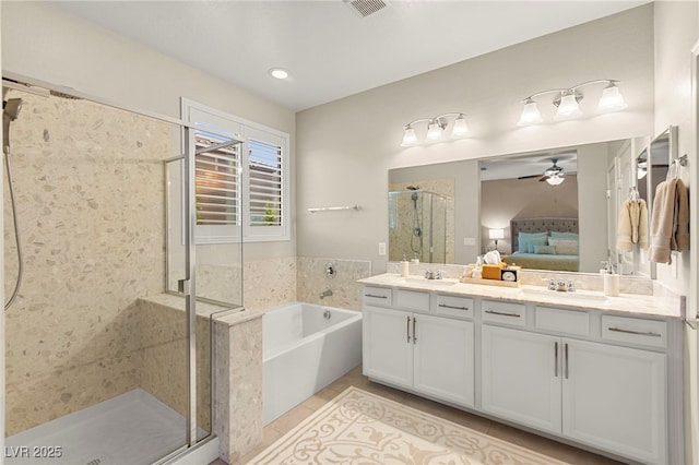 419 Vigo Port St, Las Vegas, NV 89138 - bathroom featuring connected bathroom, a stall shower, a garden tub, double vanity, and ceiling fan