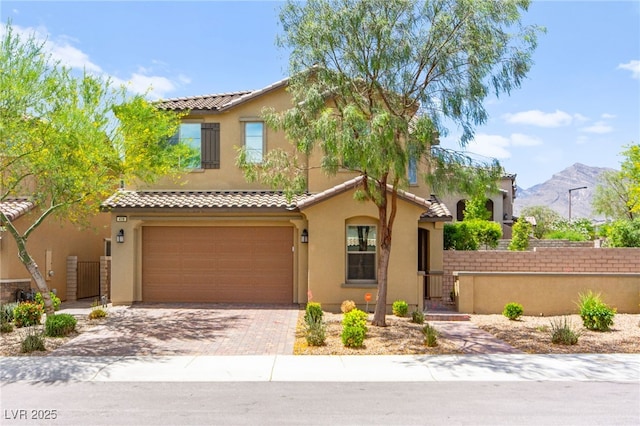 419 Vigo Port St, Las Vegas, NV 89138 - mediterranean / spanish house with a tile roof, stucco siding, and a gate