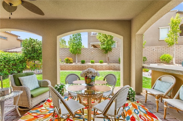 419 Vigo Port St, Las Vegas, NV 89138 - fenced backyard with a patio, a ceiling fan, and outdoor dining space