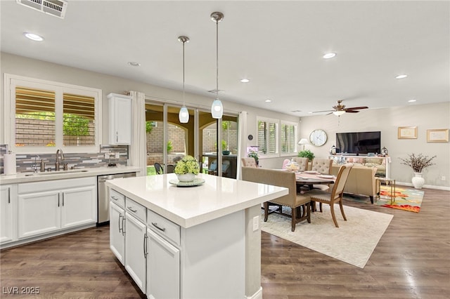 419 Vigo Port St, Las Vegas, NV 89138 - kitchen featuring a sink, dishwasher, ceiling fan, white cabinets, and light countertops