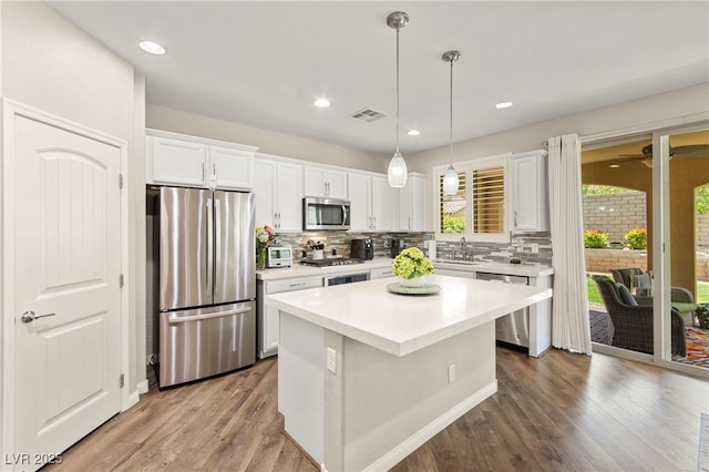 419 Vigo Port St, Las Vegas, NV 89138 - kitchen with appliances with stainless steel finishes, tasteful backsplash, white cabinets, light countertops, and recessed lighting