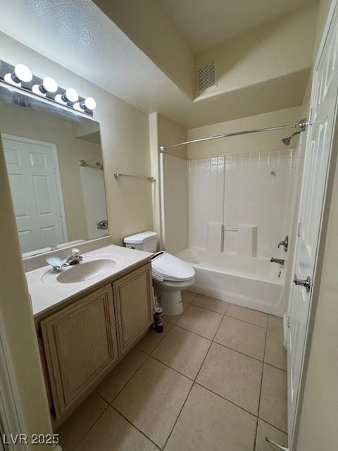 full bathroom featuring tile patterned flooring, vanity, toilet, and bathing tub / shower combination