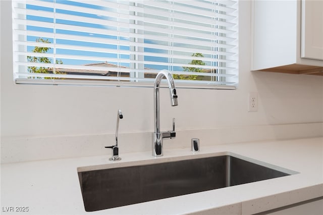 2767 Lindsey Springs St, Las Vegas, NV 89142 - kitchen view of white cabinetry and light countertops