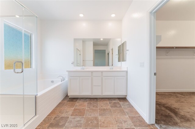 2767 Lindsey Springs St, Las Vegas, NV 89142 - full bath with a garden tub, a shower stall, double vanity, a spacious closet, and recessed lighting