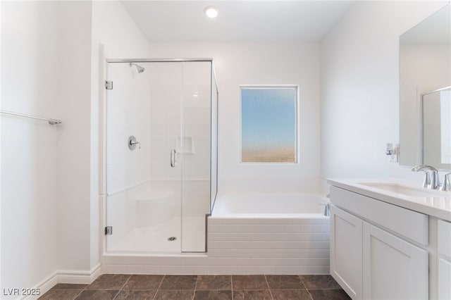 2767 Lindsey Springs St, Las Vegas, NV 89142 - full bath featuring vanity, a garden tub, a stall shower, and recessed lighting