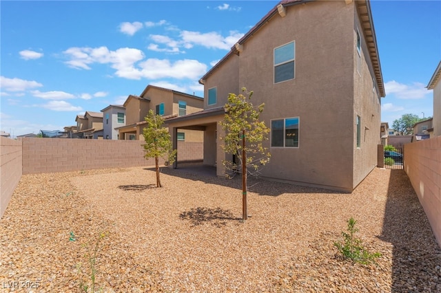 2767 Lindsey Springs St, Las Vegas, NV 89142 - back of property featuring stucco siding, a fenced backyard, and a residential view