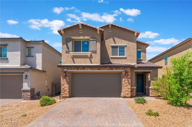 2767 Lindsey Springs St, Las Vegas, NV 89142 - view of front facade with a garage, stucco siding, decorative driveway, and stone siding