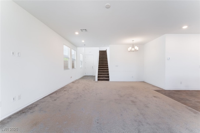 2767 Lindsey Springs St, Las Vegas, NV 89142 - unfurnished room with stairs, a chandelier, light carpet, and recessed lighting