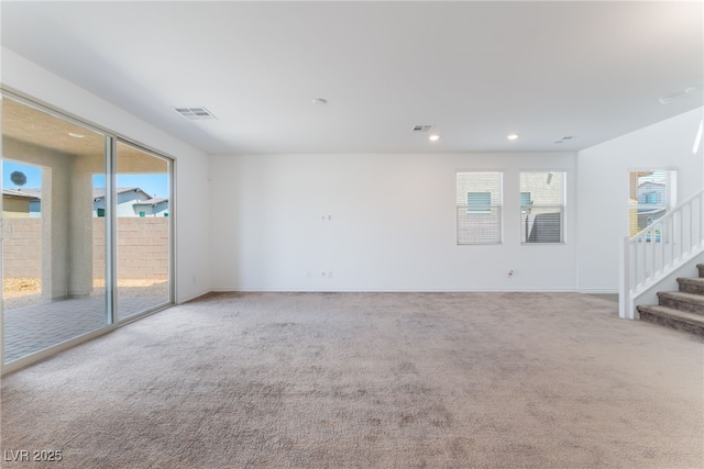 2767 Lindsey Springs St, Las Vegas, NV 89142 - empty room with light colored carpet, healthy amount of natural light, stairway, and recessed lighting